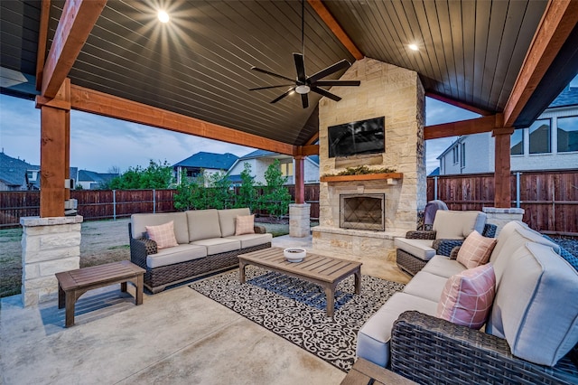 view of patio / terrace featuring an outdoor living space with a fireplace and ceiling fan