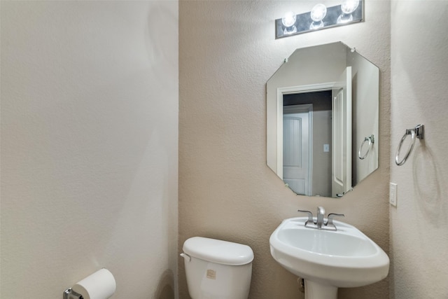 bathroom with toilet and sink