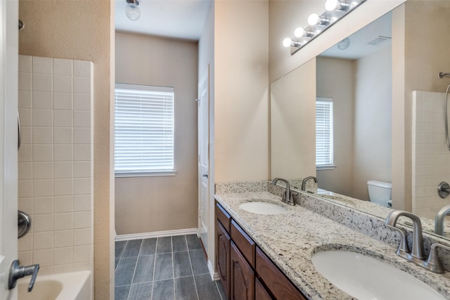 full bathroom featuring vanity, shower / bathtub combination, and toilet