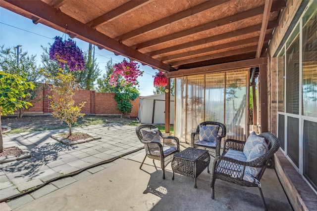 view of patio featuring a storage unit