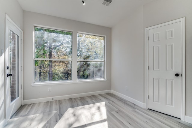 unfurnished room featuring light wood-type flooring