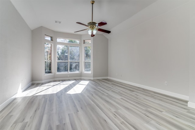 unfurnished room with vaulted ceiling, light hardwood / wood-style flooring, and ceiling fan