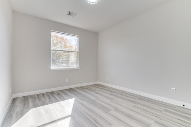 unfurnished room featuring light hardwood / wood-style flooring