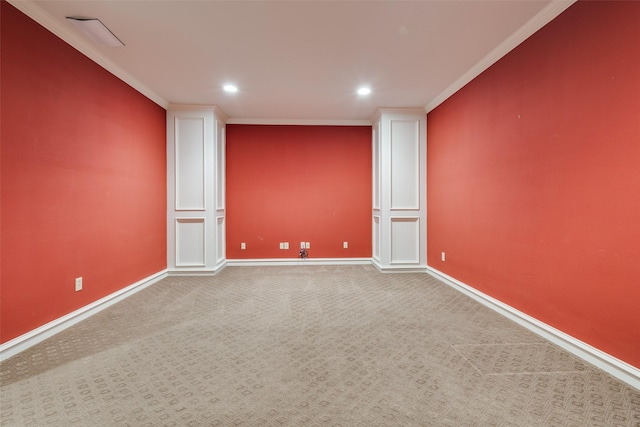 empty room with carpet flooring and crown molding