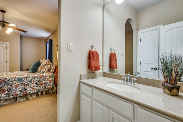 bathroom featuring ceiling fan and vanity