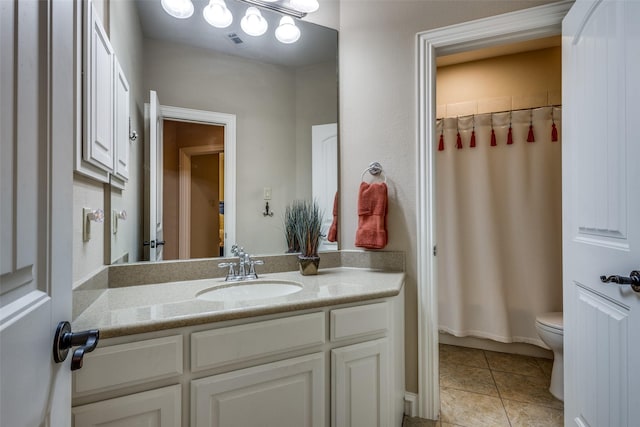 full bathroom with tile patterned floors, vanity, toilet, and shower / bath combo