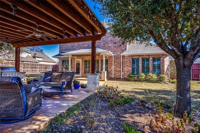 view of patio with an outdoor hangout area, ceiling fan, exterior kitchen, and a grill