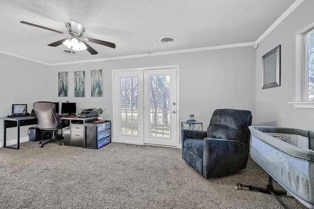 office space featuring carpet flooring, ceiling fan, crown molding, and a textured ceiling