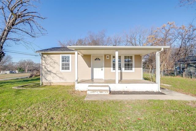 bungalow featuring a porch and a front lawn