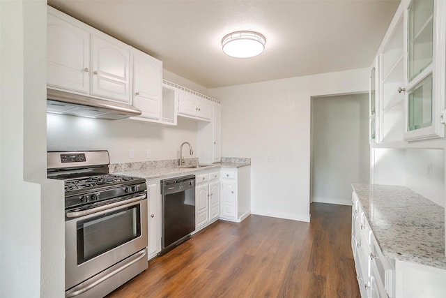 kitchen with dishwasher, stainless steel gas range oven, white cabinets, sink, and light stone countertops