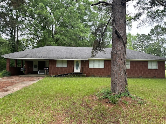 ranch-style house with a carport and a front yard