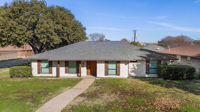 ranch-style house with a front yard