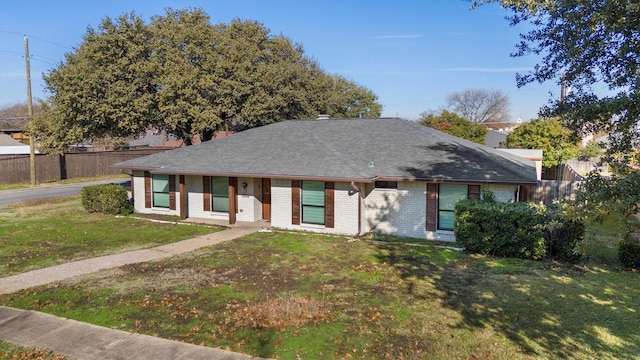 ranch-style house featuring a front lawn