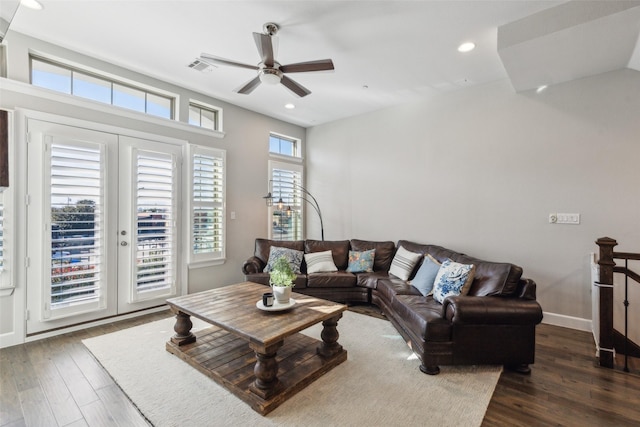 living room with ceiling fan and dark hardwood / wood-style floors