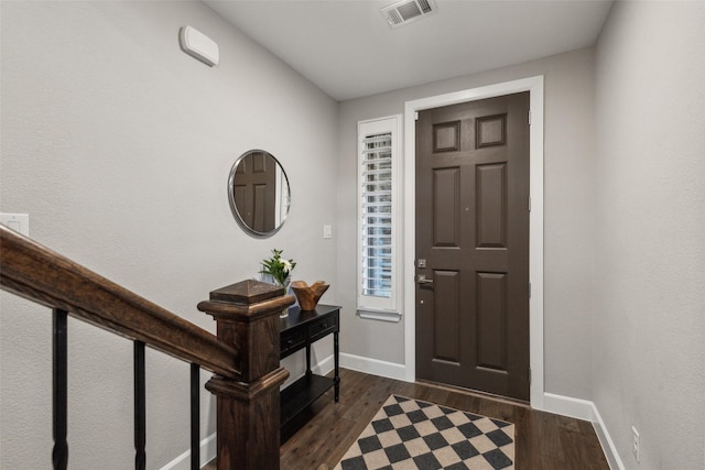 foyer featuring dark wood-type flooring