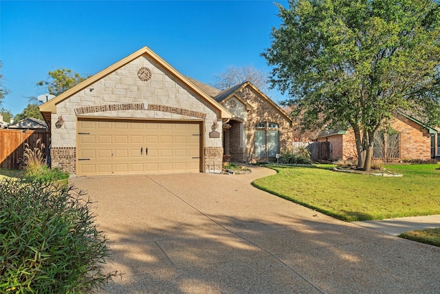 view of front facade with a garage and a front yard