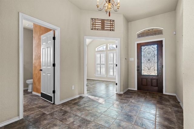 entryway with an inviting chandelier