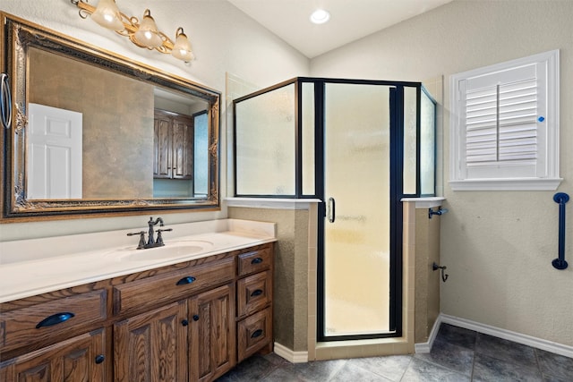 bathroom featuring tile patterned floors, vanity, and walk in shower