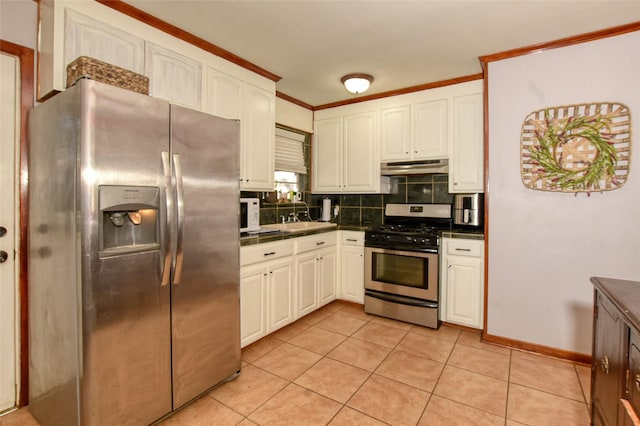 kitchen with white cabinets, light tile patterned floors, sink, and appliances with stainless steel finishes