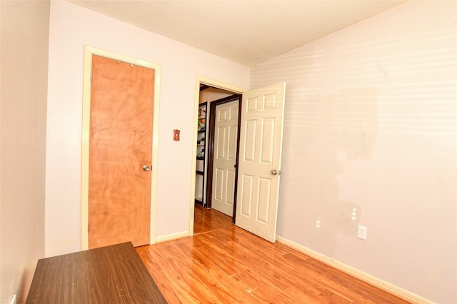 empty room with light hardwood / wood-style flooring