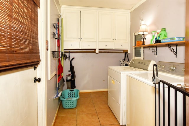 laundry area with cabinets, light tile patterned floors, separate washer and dryer, and ornamental molding