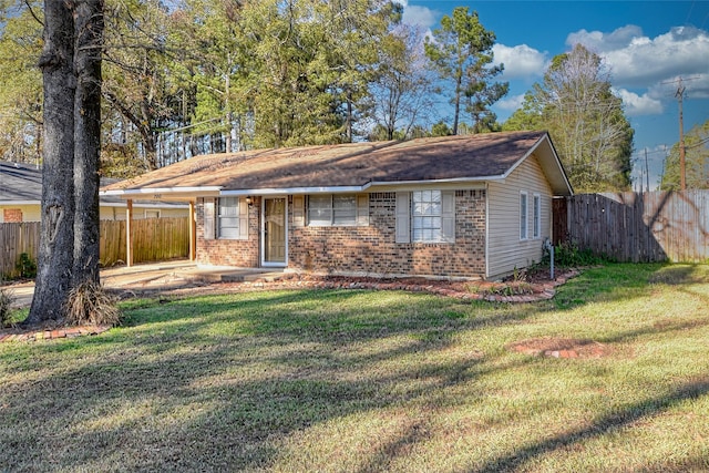 single story home with a front lawn and a patio