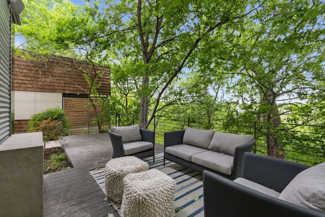 wooden terrace featuring an outdoor hangout area