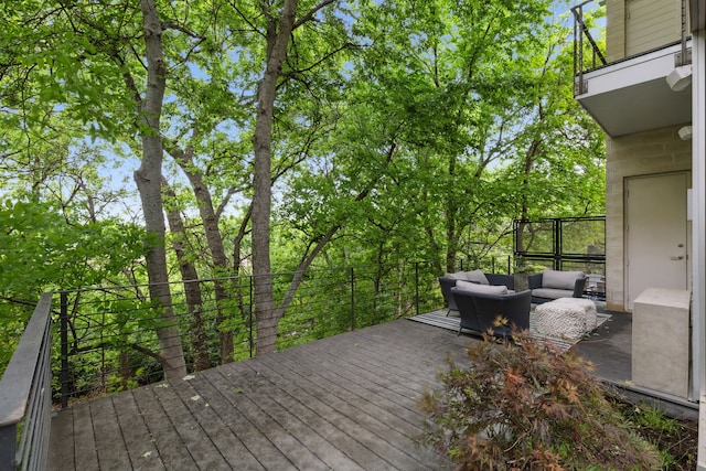 wooden deck featuring an outdoor living space