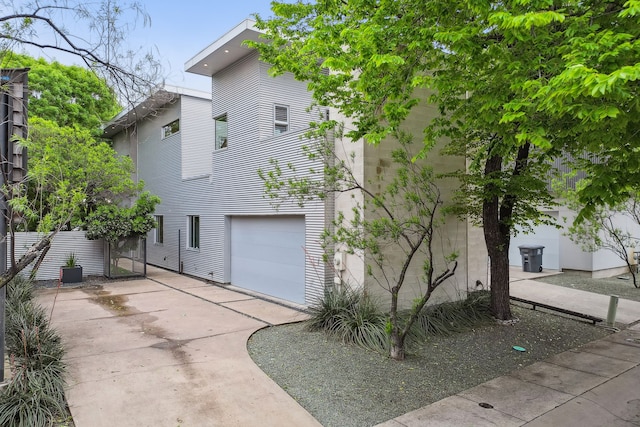 view of property exterior with a garage