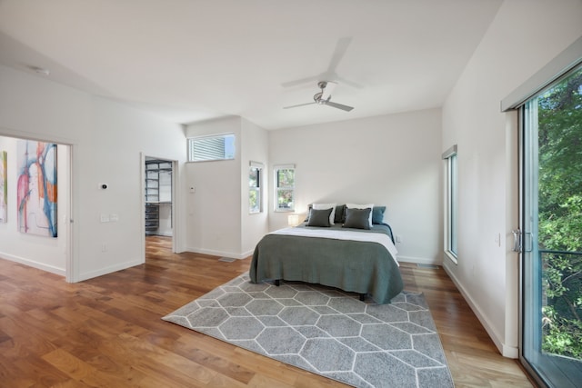 bedroom with ceiling fan and hardwood / wood-style flooring