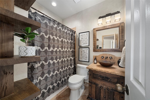 bathroom featuring tile patterned floors, vanity, toilet, and a shower with curtain