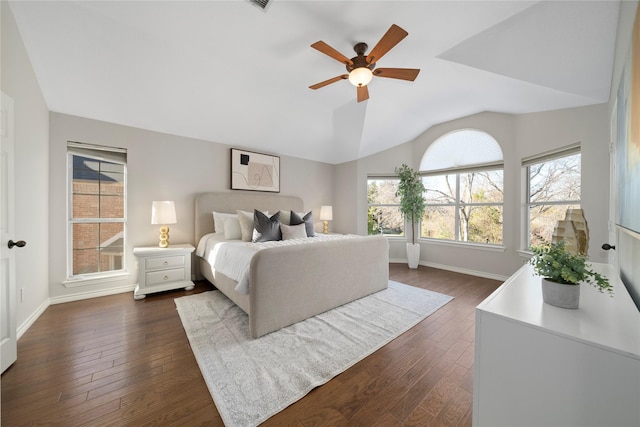 bedroom featuring dark hardwood / wood-style floors, ceiling fan, and lofted ceiling