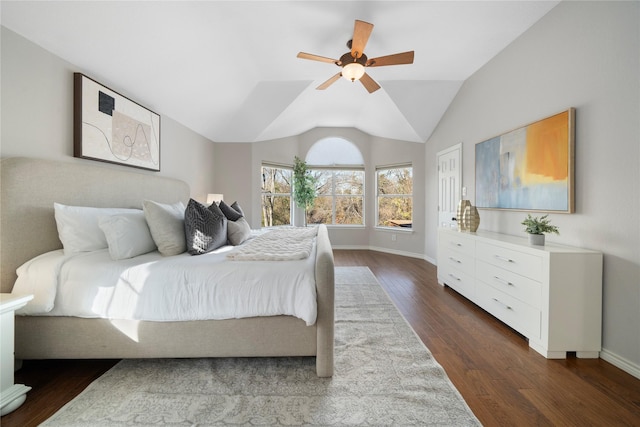 bedroom with vaulted ceiling, ceiling fan, and dark hardwood / wood-style floors