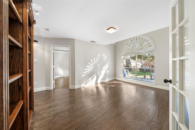 unfurnished room with french doors and dark hardwood / wood-style flooring