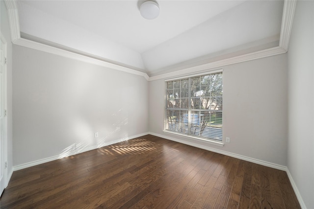 empty room with dark wood-type flooring and vaulted ceiling