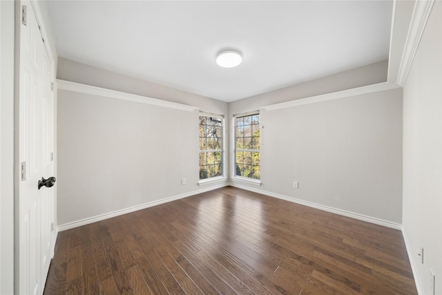 empty room featuring dark hardwood / wood-style flooring