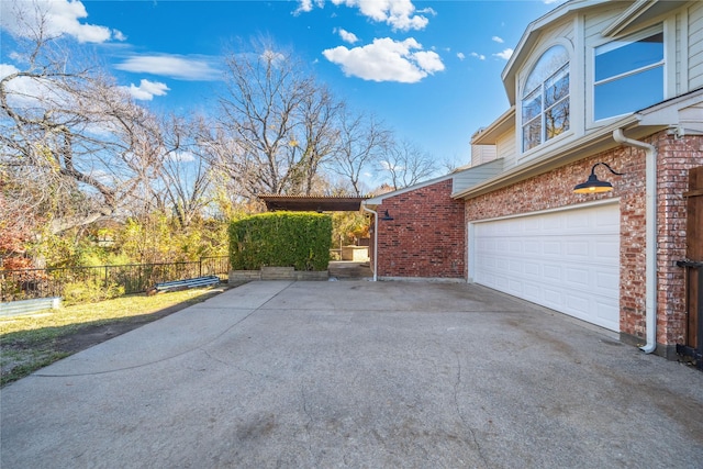 view of property exterior featuring a garage