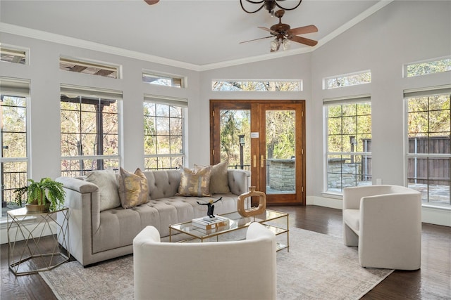 sunroom with ceiling fan, french doors, and vaulted ceiling