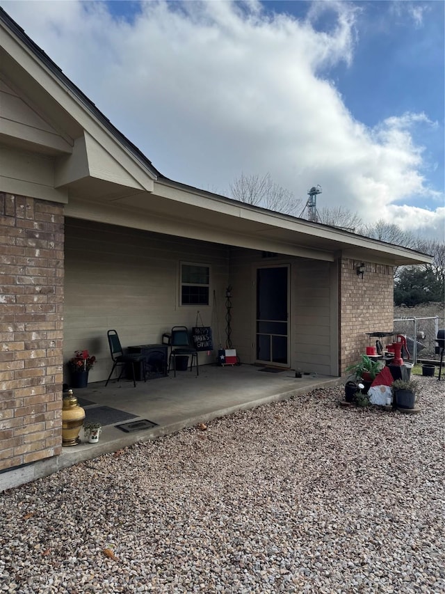 back of house with a patio area