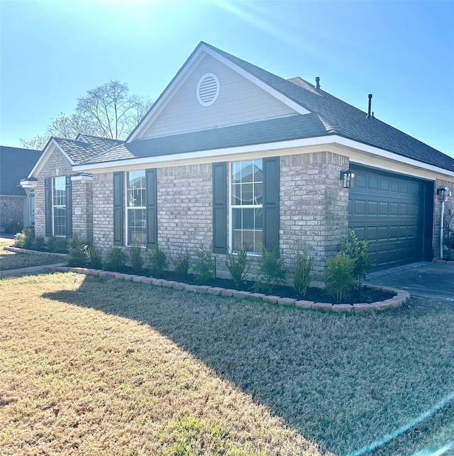 view of property exterior featuring a garage and a lawn