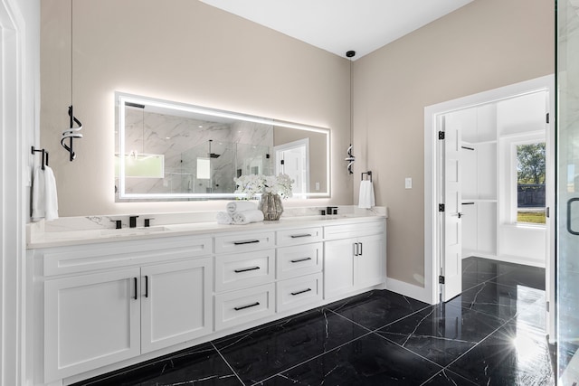 bathroom featuring vanity and an enclosed shower