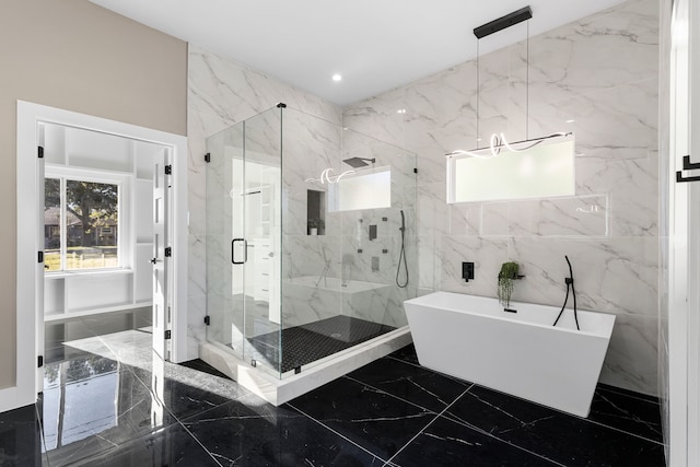 bathroom with separate shower and tub