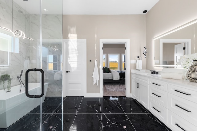 bathroom featuring a shower with door and vanity