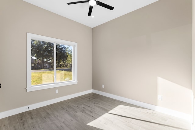 empty room featuring ceiling fan and light hardwood / wood-style floors