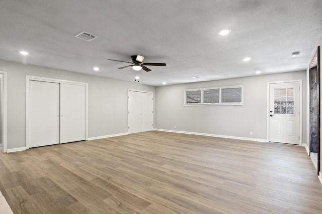 interior space with ceiling fan and light hardwood / wood-style flooring