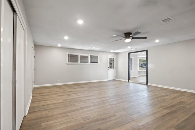 interior space with ceiling fan and light wood-type flooring