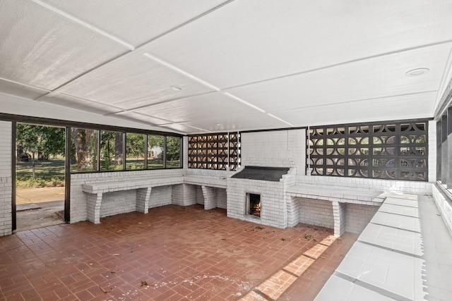 view of patio with a fireplace