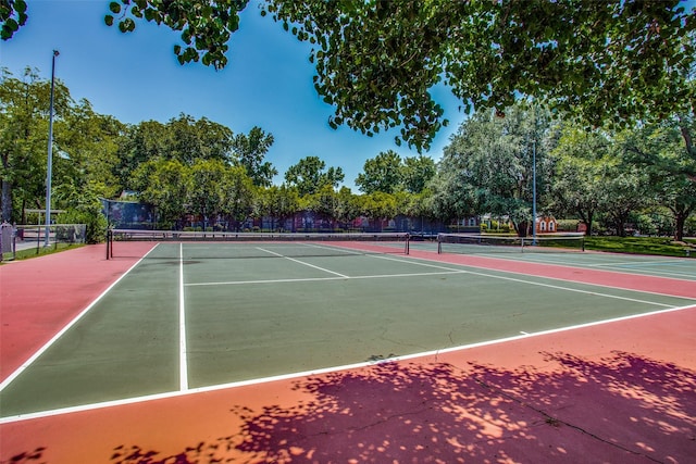 view of sport court with basketball hoop