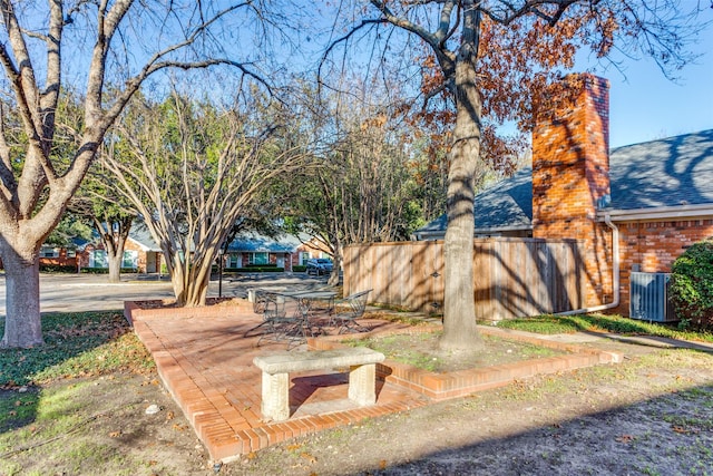 view of yard with a patio area and central air condition unit