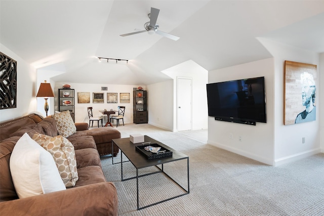 living room with vaulted ceiling, ceiling fan, light colored carpet, and rail lighting